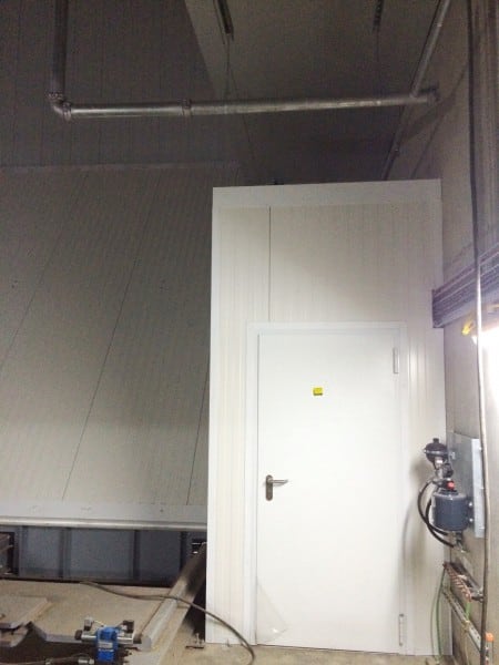 An access door is built into the partition